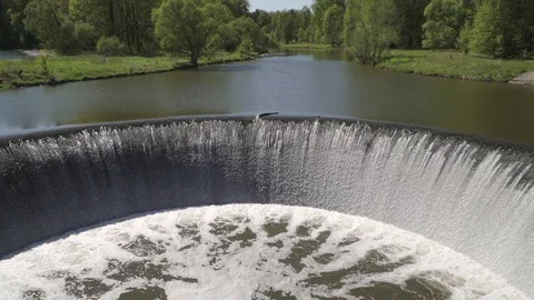 Water falling over a river dam in slow motion Stock-Footage 89652931