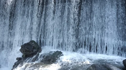 Water falling over rocks in slow motion, splashes waterfall close up Stock Footage 123679920