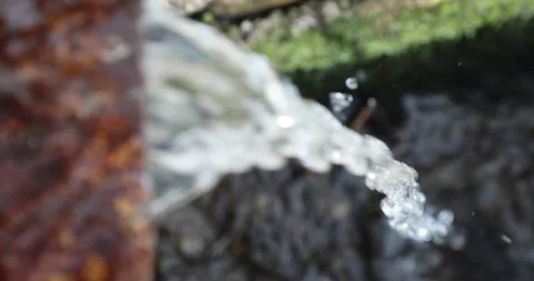 Water falling from pipe Видео 335584253