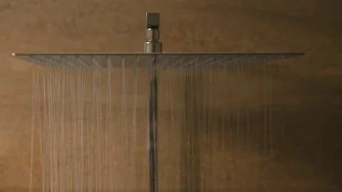 Water falling from the rain shower in the bathroom. shower head with rain spo Stock Footage 197109013