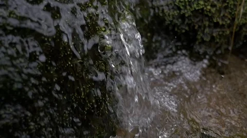 Water falling river creek bubbles winter forest macro Stock Footage 80416045