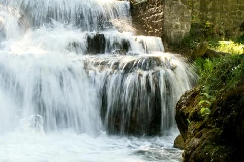 Water falling on rocks Stock Photos