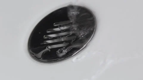 Water falling in a sink falling down the basin, on a white background Stock-Footage 137364782