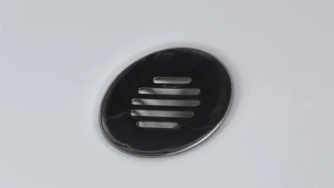 Water falling in a sink falling down the basin, on a white background Video stock 137364879