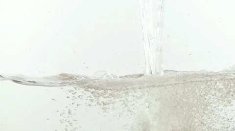 Water falling into white background slow motion HD video. Splash bubbles waves Stock Footage 68458436