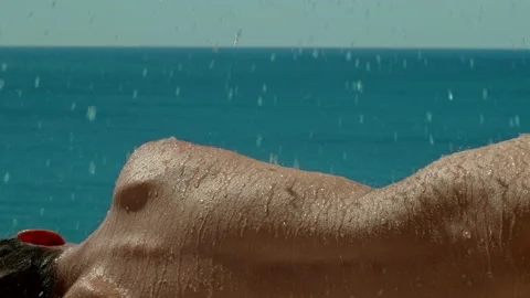  Water falling on a woman's back in the sun. Stock Footage 161471828