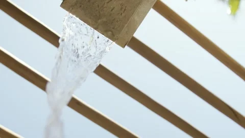 Water falling from wooden structure Stock Footage 306462334