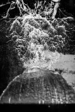 Water falls and creates pattern on cement Stock Photos