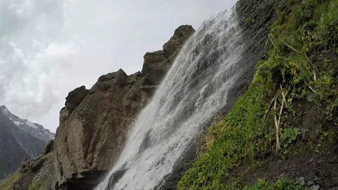 Water falls from big rock Stock Footage 118647467