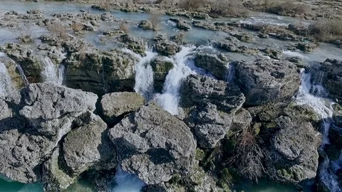 Water falls down a waterfall. Big amount of water falling over a rocky edge. Stock Footage 96344571