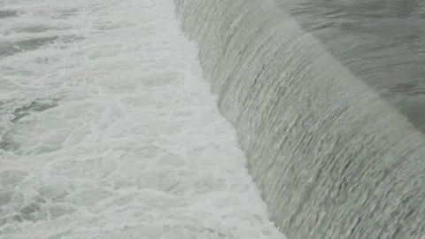 Water falls down like a waterfall on a flat river threshold Stock-Footage 271071339