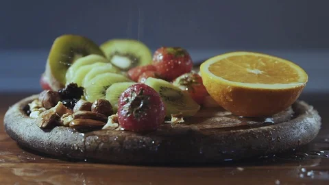 Water falls on fresh fruit Stock Footage 81165505