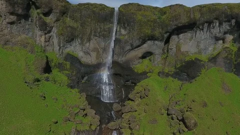 Water falls from the height and creates a rainbow. Andreev. Stock Footage 78115129