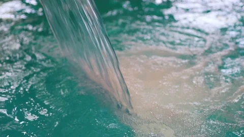 Water falls in the pool, close-up of the waterfall in the pool, resort, slow mot Stock-Footage 114279093