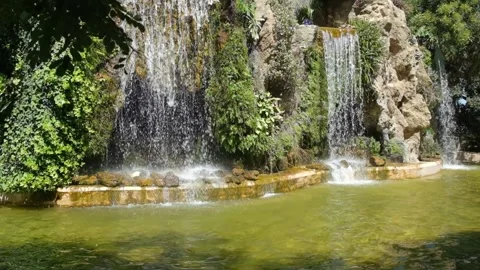 Water falls in slow motion at the Genoves Garden, Cadiz, Spain. Stock Footage 225544113