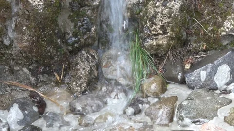 Water falls on a small stone in the yard Stock-Footage 113334640