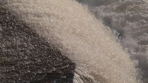 Water of a fast flowing waterfall Stock Footage 122697554