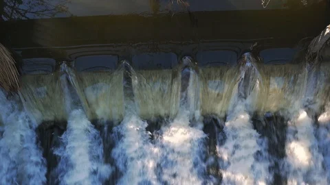 Water fast going thru the small dam Stock Footage 104099849