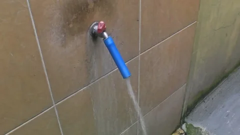 The water faucet is on Stock Footage 221338843