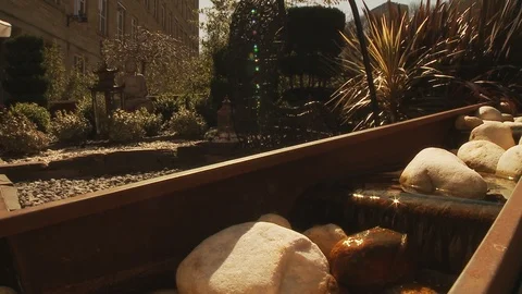 Water Feature in front of a bar on a hot sunny day - slider shot left to right Stock Footage 112722815