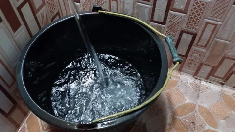 Water is filled into the bucket Stock Footage 230053690