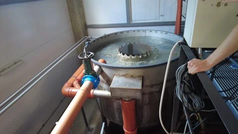 The water filtration process implemented within an industrial facility utilizes Stock Footage 347251263