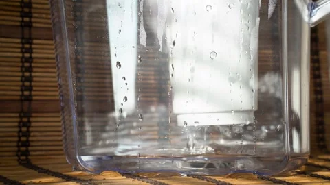 Water Filtration Process in Pitcher, Purifying Drinking Water Through Filter Stock Footage 332002288