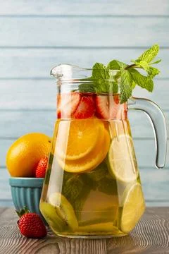 Water flavored with fresh summer fruit. Stock Photos