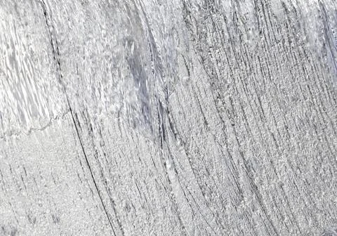Water in flow. Abstract background - lines and bands blurred by water motion. Stock Photos