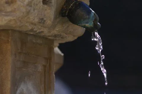 WATER FLOW OF AN ANCIENT SOURCE Stock Photos