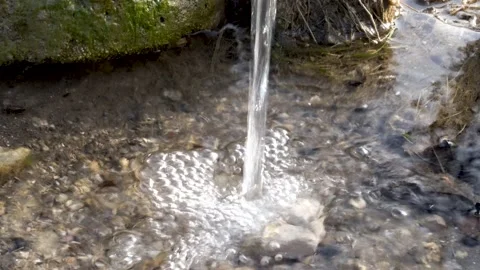 Water flow and splash at mossy stone background Stock Footage 156323880