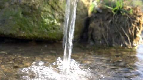 Water flow and splash at mossy stone background Stock-Footage 156325836