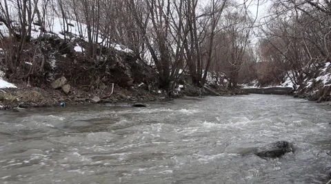 Water flow in city polluted river Stock Footage 59947321