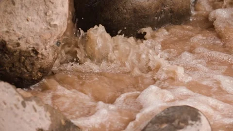 Water flow in a crevice in a rock Stock Footage 292592936
