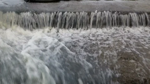 Water flow of dike Stock Footage 97260807