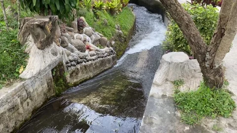 Water flow down on the ditch or small paved river Stock Footage 295496206