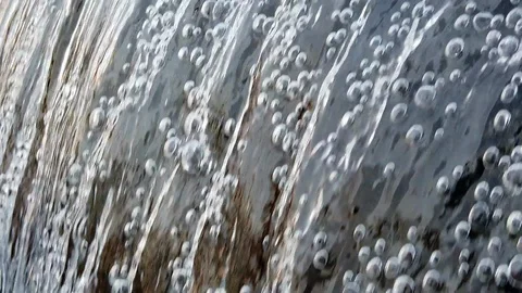 Water flow falling down into water making foam in fountain Stock Footage 103346008