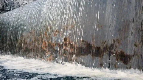 Water flow falling down into water making foam in fountain Stock Footage 103826977