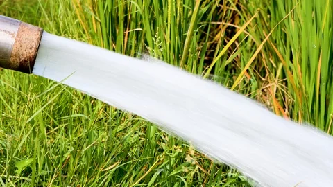 Water flow fields green motor electric village Stock Footage 97494926