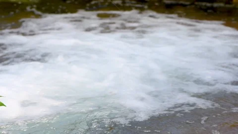 Water flow foam clean closeup 4k Stock Footage 97494815