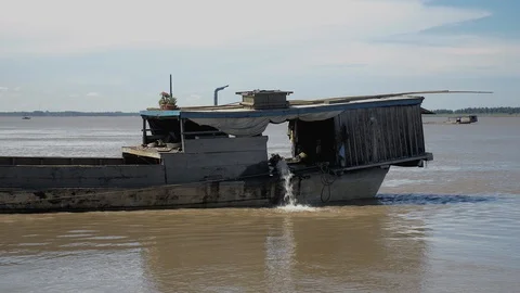 Water flow generated by a water pump impeller at the rear of a sand dredging bar Stock Footage 100392458