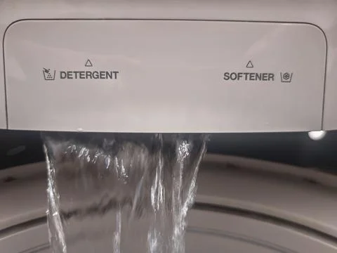 Water Flow Inside Washing Machine Detergent Drawer During Laundry Cycle Foto stock