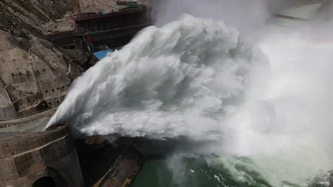 Water flow out of a dam, with a rainbow Video stock 139376396