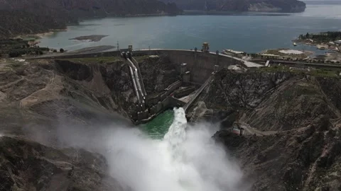 Water flow out of a dam, with a rainbow Video stock 139377638