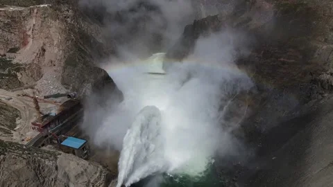 Water flow out of a dam, with a rainbow Video stock 139378271