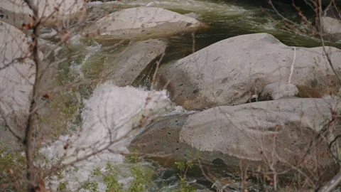 Water Flow Passing Over Smooth Rocks Stock Footage 314896004