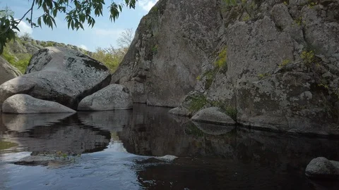 Water flow on the river and large rocks in Aktov Canyon Stock Footage 108224241