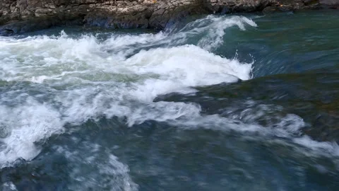 Water flow at rocky riverside Stock Footage 186746030