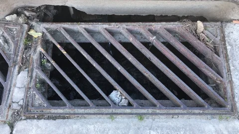 Water Flow in to a Sewer of a Pavement Stock-Footage 102229667