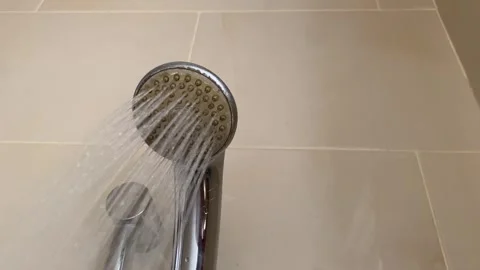 Water flow from shower head in bathroom Stock Footage 301180722